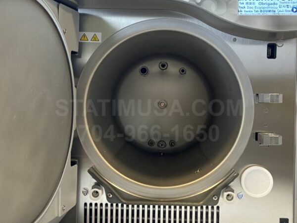 This is a front view of a Scican Statclave G4 autoclave showing the chamber open.