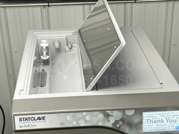 This is a Scican Statclave G4 autoclave with the venturi reservoir access door open.