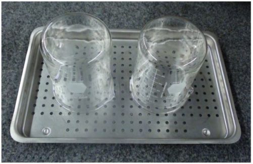 The proper positioning for glassware on the tray for sterilization.
