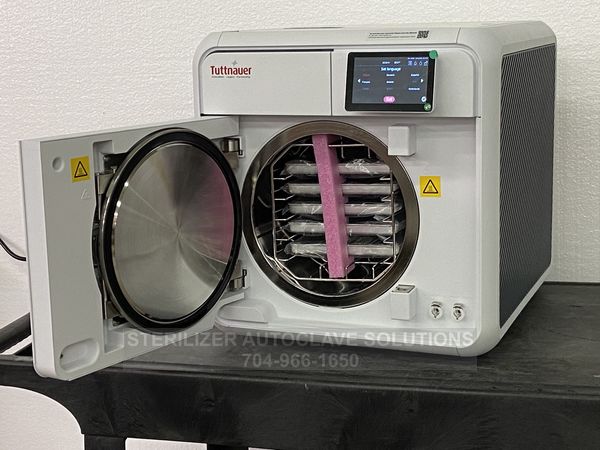 This is the front view of a Tuttnauer T-Edge 10S 220v 10″X18″ Chamber Autoclave with the front door open showing the chamber, rack, and trays.