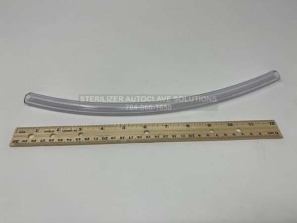 This is a Midmark M9 and M11 Clear Drain Tube RPI #rph285 next to a ruler for length comparison.