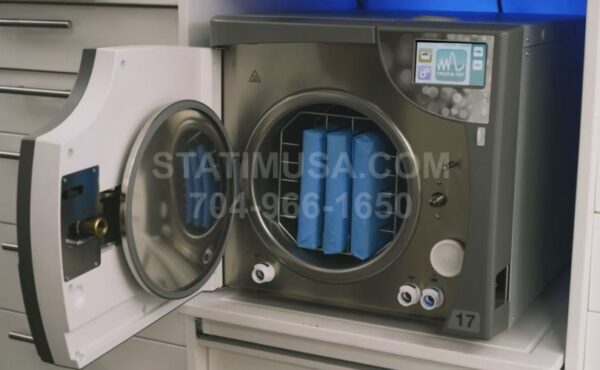 This is the SciCan Bravo G4 Chamber Autoclave with the door open showing the cassettes.